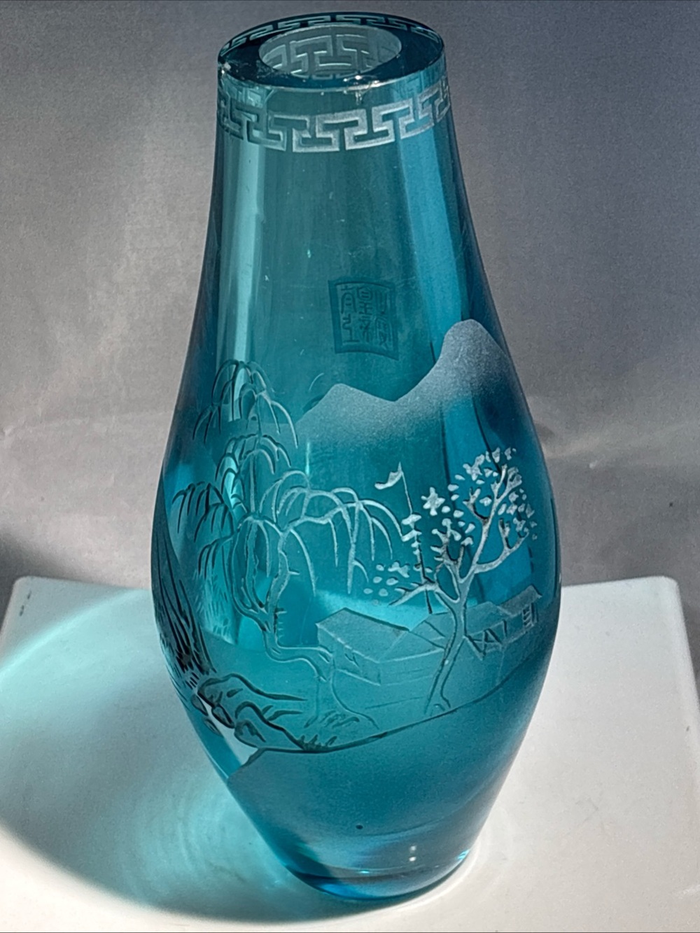 Rare turquoise Peking glass vase. 10” tall. Greek key design Etched 2 chips